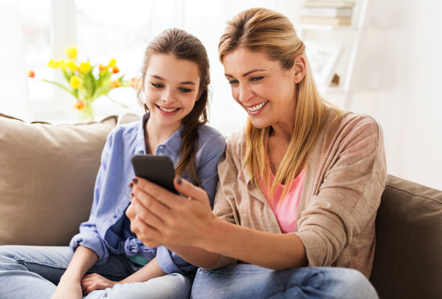 Mom and Daughter looking at Twigby phone