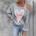 Show off your style with this One Shoulder Sling Heart Printed Sweatshirt for just $13.64 After Code (Reg. $20.99)